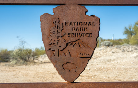 Tucson, United States: January 24, 2023: Metal National Park Sign on Gate at entrance to Saguaro wildernessの写真素材