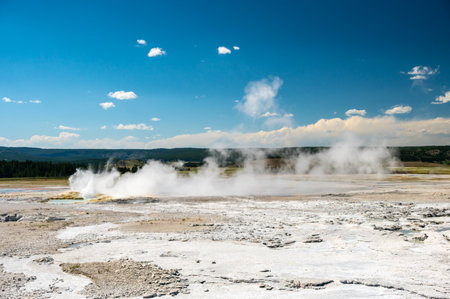 Steam Rises From Fountain Geyser On Summer Day in Yellowstoneの写真素材