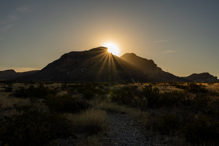 Sun Bursts Over Chisos Mountains To Light The Valley Below in Big Bendの写真素材