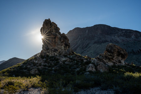 The Chimney Formation With Sun Burst Wrapping Around The Left Side in Big Bendの写真素材