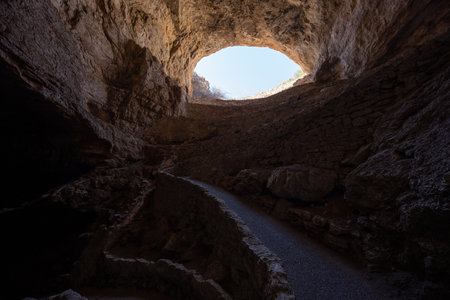 Looking Back Uphill Through The Entrance to Carlsbad Caverns National Parkの写真素材