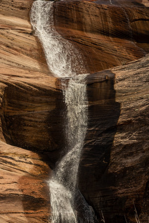 Detail Of Snow Melt Creek FallIng Over The Walls Of Zion National Parkの写真素材