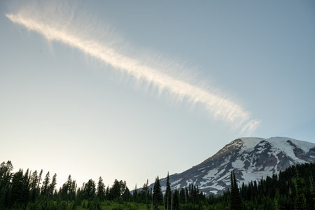 Long Wisp Of Cloud Points Toward The Top Of Mount Rainier just before sunsetの写真素材