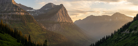 Hazy Glow Fills The Valley Below Mount Cannon in Glacier National Parkの写真素材