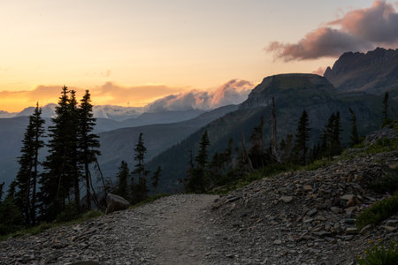 Wave Of Clouds Roll Over The Ridges Beyond Granite Park Along The Highline Trail in Glacier National Parkの写真素材
