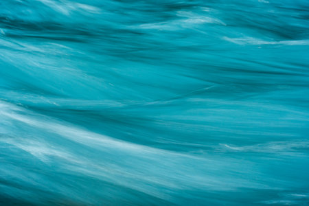 Sweeping Ripples Of Rushing Water In The Hoh River in Olympicの写真素材