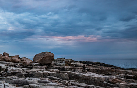 Subtle Sunset Colors Over Rocky Maine Beach in Acadiaの写真素材