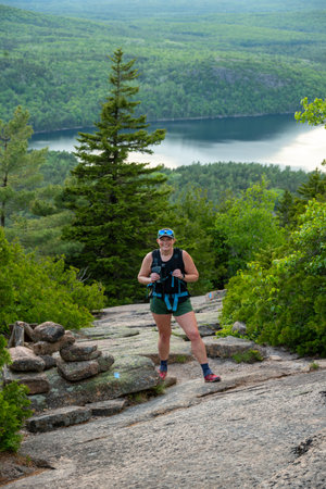 Woman Next to Bates Cairns on the Cadillac West Face Trail in Acadiaの写真素材