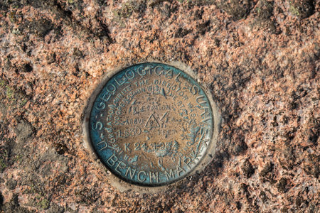 Geological Survey Benchmark Embedded in Rock in Acadiaの写真素材