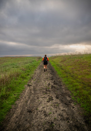 Hiker On Santa Cruz Islands Walks Muddy Path On Cloudy Day in Channel Islands National park
