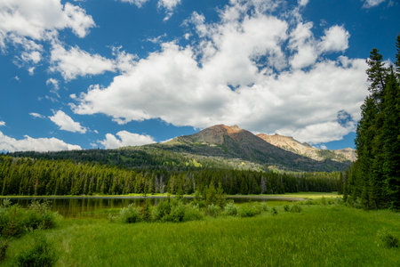 Large Clouds Rise Over Cache Lake And Electric Peak in Yellowstoneの写真素材
