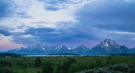 Moody Blue Skies Over Grand Teton Range at Sunriseの写真素材