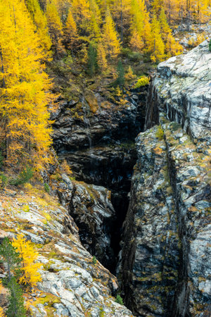Waterfalls Spill Over The Golden Rim Of Gorner Gorge below the Matterhornの写真素材