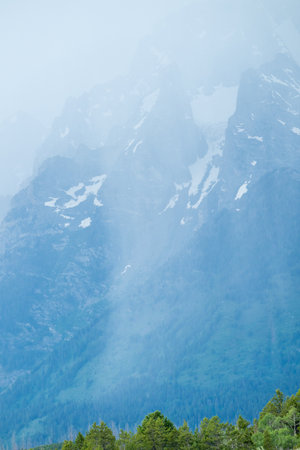 Rain Pours in Front of Mountain in Grand Teton National Park in mid-summerの写真素材