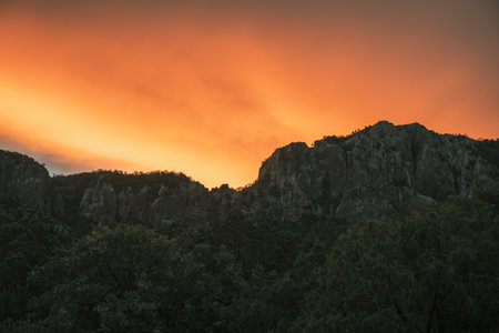 Orange Clouds Hang Over The Ridge In The Chisos Mountains of Big Bendの写真素材