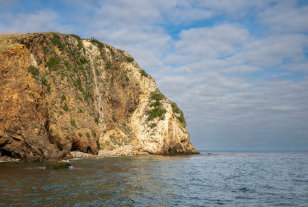 Two Hikers Stand Atop HIll At Scorpion Anchorage On Santa Cruz Island in Channel Islands National Parkの写真素材