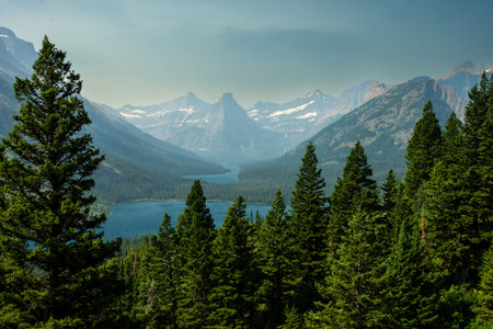 Pyramid Peak Rises Behind Cosely Lake And Glenns Lake In Glacier National Parkの写真素材