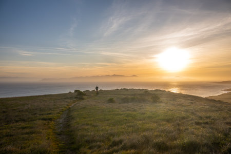 Distant Hiker On Winding Trail Over A Hillside On Santa Rosa Island in Channel Islands National Parkの写真素材