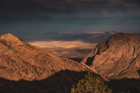 Sunlight Breaks Through Thick Cloud Cover To Hightlight The Window and Valley Belowの写真素材