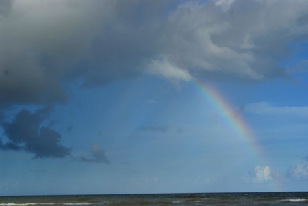 Rainbow over gulf at surfside beach texasの写真素材