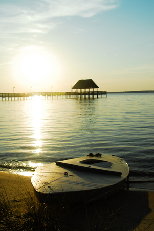 old sailboat beached in lagoon and sunkの写真素材