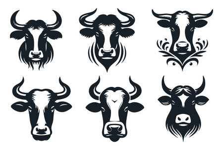 Set of black and white cow heads with ornament. Vector illustration.のイラスト素材