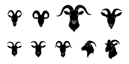 Set of black silhouettes of goat heads isolated on white background. Vector illustrationのイラスト素材