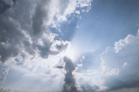 sunlight through dramatic clouds