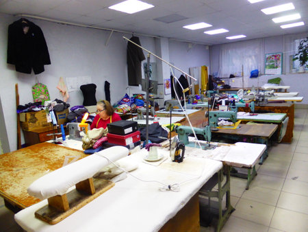Seamstress at work in a sewing studioの写真素材