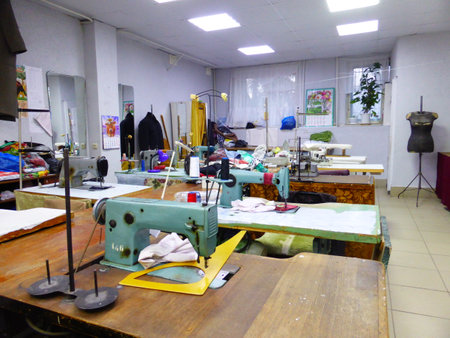 Seamstress at work in a sewing studioの写真素材