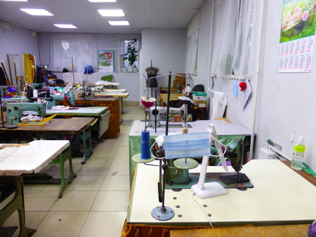 Seamstress at work in a sewing studioの写真素材