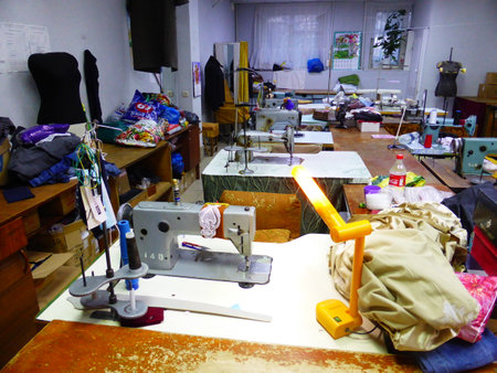 Seamstress at work in a sewing studioの写真素材