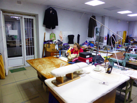 Seamstress at work in a sewing studioの写真素材
