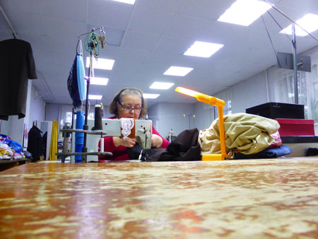 Seamstress at work in a sewing studioの写真素材