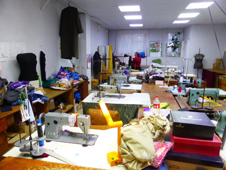 Seamstress at work in a sewing studioの写真素材
