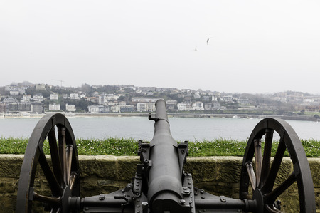 cannon decorative  pointing toward the city in San Sebastian,Spainの写真素材