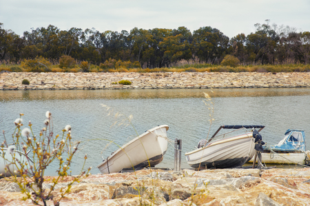 modest fishing boats in the river bank in Guardamar del Segura, Alicante.Spainの写真素材