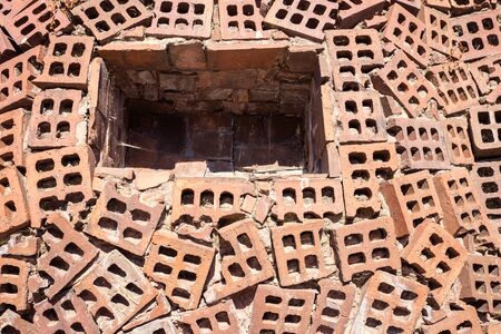 background of niche on brick facade with a holes pattern