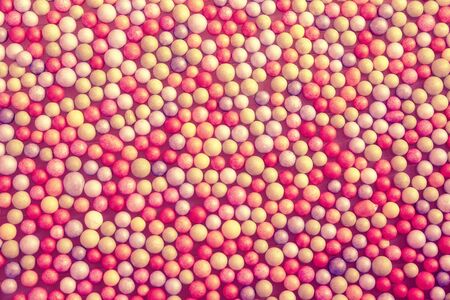 multicolored background with small pink ballsの写真素材