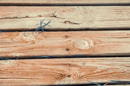 close-up of three horizontal wood strips. wooden background