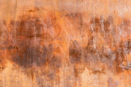 front view of damaged iron wall with rusted texture