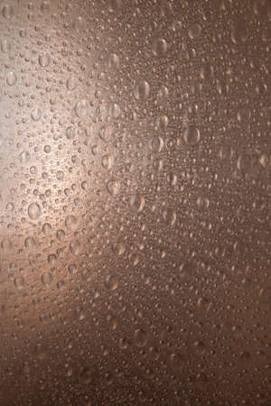 rough plastic surface with synthetic water drops illuminatedの写真素材