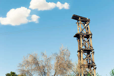 view of a platform on wooden tower to descend by cables