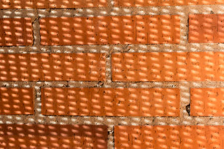 rocky shore with blue and green sea rocks eroded by waterの写真素材