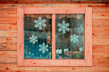 view of wooden facade with Window showing Christmas motifsの写真素材