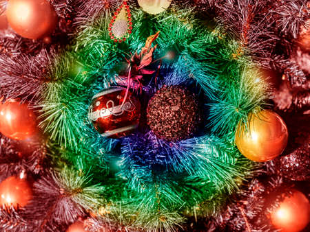 background with multicolor Christmas ornaments on treeの写真素材
