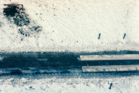 top view of road cleared of snow to allow cars to circulateの写真素材