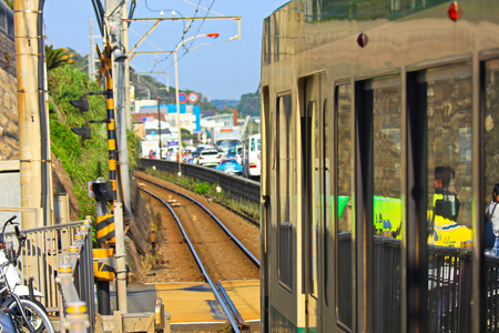 KAMAKURA, JAPAN - June 4: Enoden Line in Kamakura, Japan on June 4, 2015. Enoshima Electric Railway, has 100 years of history, links the central Shonan area, Kamakura and Fujisawa.のeditorial素材