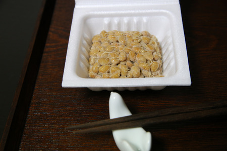Scoop up with chopsticks Japanese nattoの写真素材
