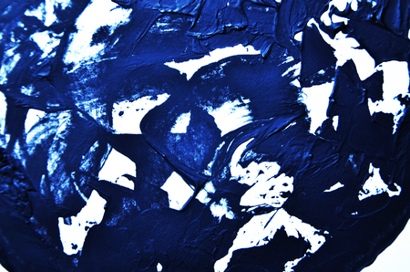 Blue background. Smears of oil paint on white background. Grunge texture, fresh paint. Bright design element. Abstract hand paintedの写真素材
